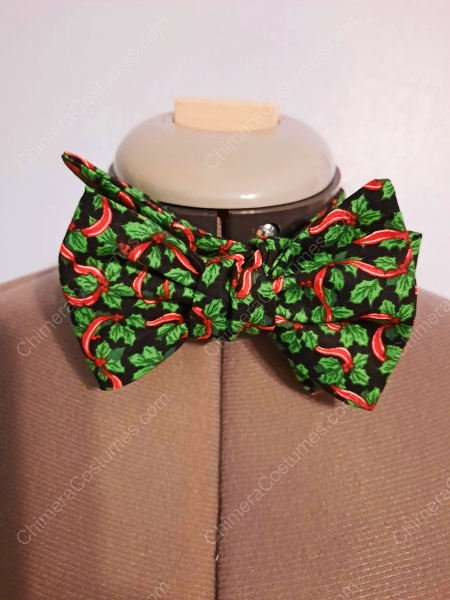 A festive bowtie adorned with bright red and green colors, embellished with cheerful holiday motifs like snowflakes, holly, and jolly Santas, ideal for adding a touch of Christmas spirit to any outfit.