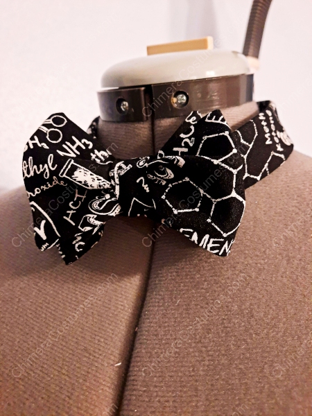 A stylish bowtie featuring colorful chemical elements and molecular structures, perfect for science enthusiasts or anyone looking to add a touch of academic flair to their attire.