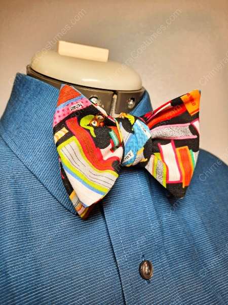 A charming bowtie crafted from the covers of vintage library books, showcasing a nostalgic and literary vibe, ideal for book lovers or anyone seeking a unique accessory with character.